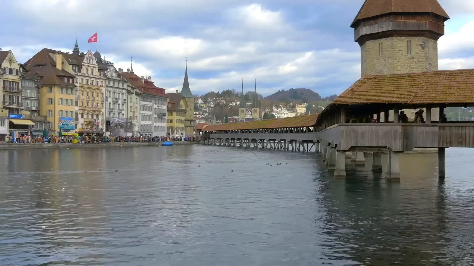Chapel Bridge over the Reuss River in Lucerne with historic buildings