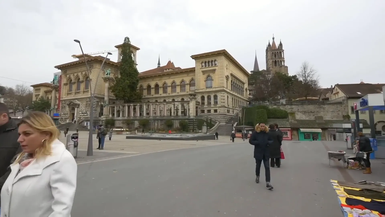 Lausanne Cathedral towering over the city with Lake Geneva in the distance