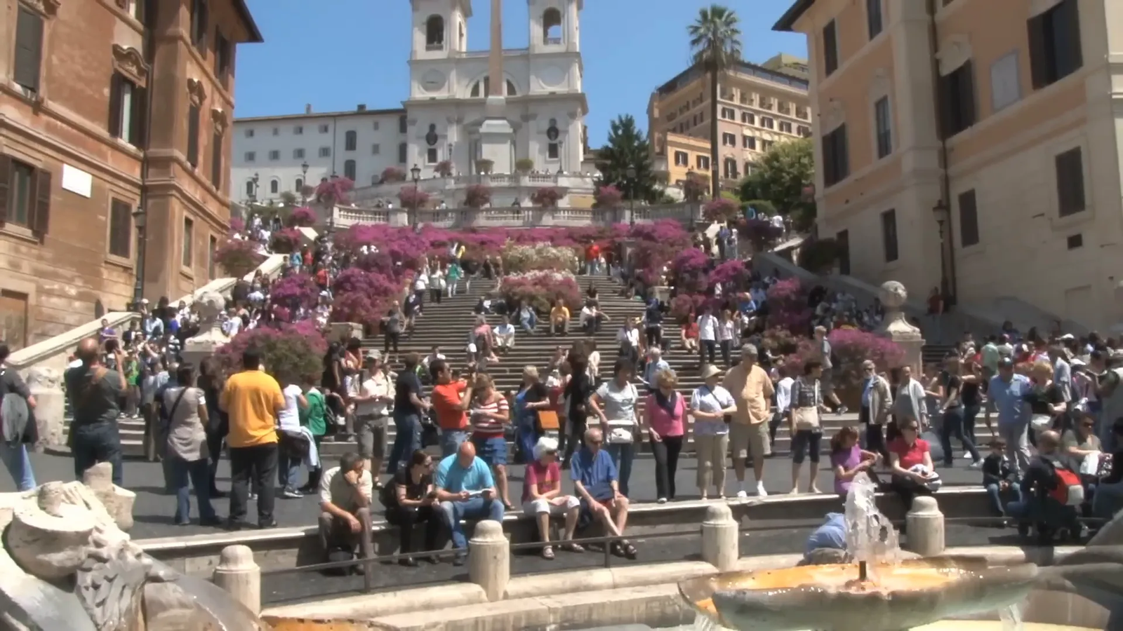 The Spanish Steps crowded with visitors and lined with azaleas in spring