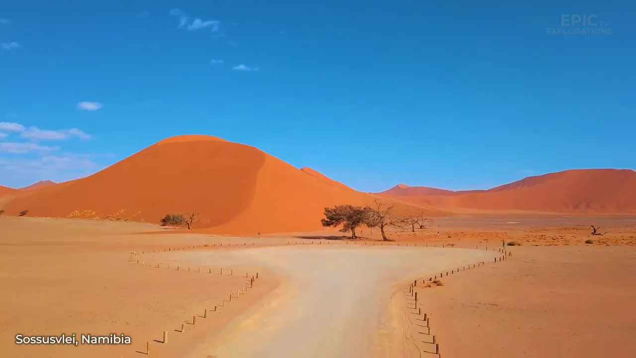 Sunrise over Sossusvlei's towering orange dunes
