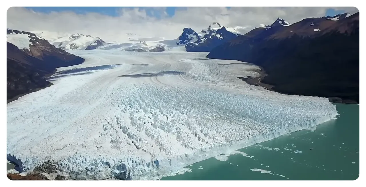 Perito Moreno Glacier calving into a turquoise lake