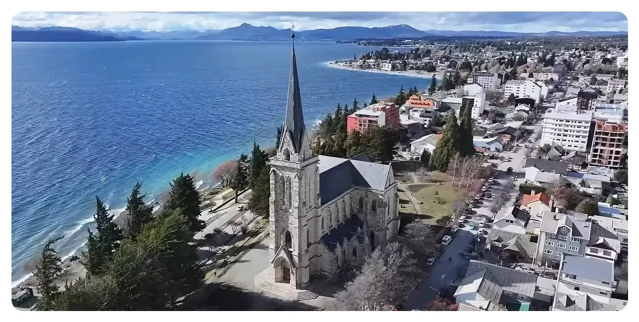 Bariloche lakeside with alpine-style buildings and mountains