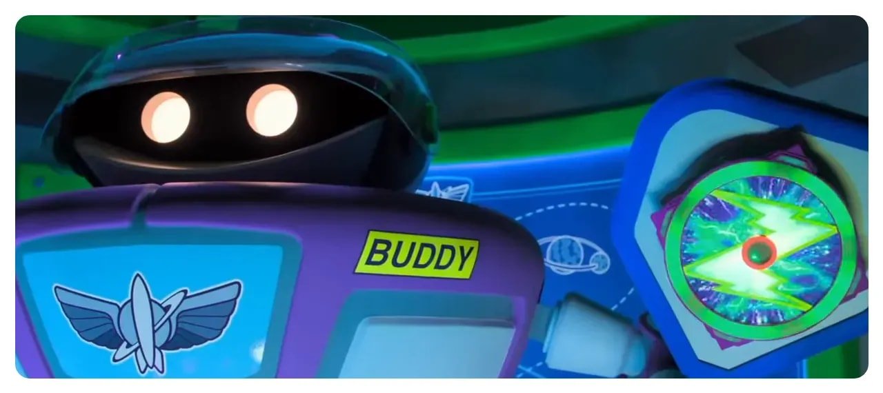 Close-up of the 'Buddy' animatronic and an updated target element in Buzz Lightyear Space Ranger Spin
