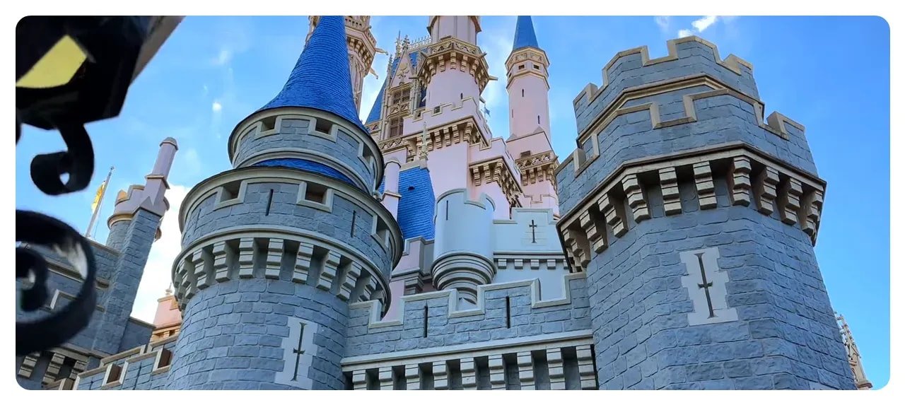 Low-angle close photo of Cinderella Castle turrets and stonework