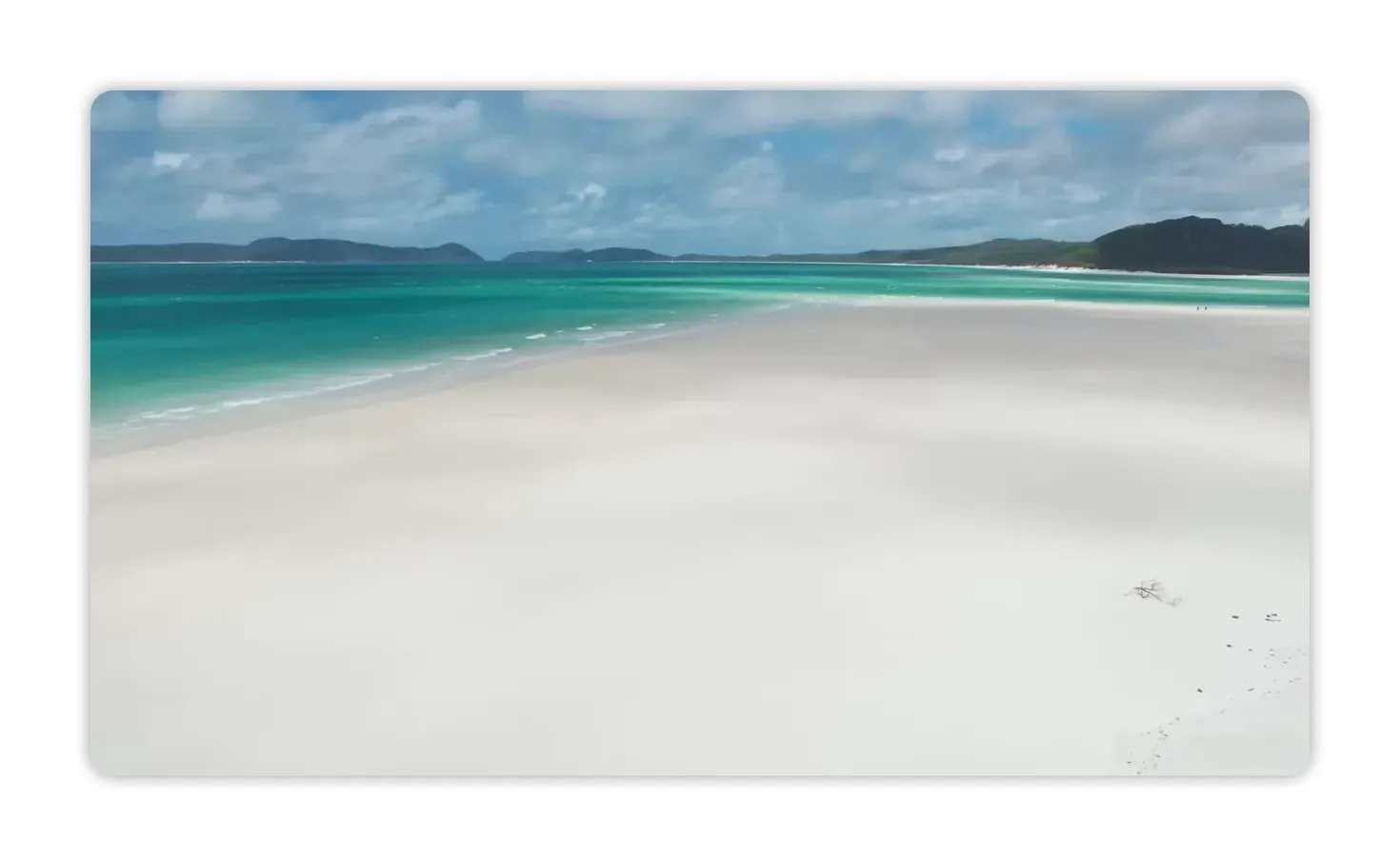 Expansive view of Whitehaven Beach showing pristine white silica sand blending into emerald-turquoise water
